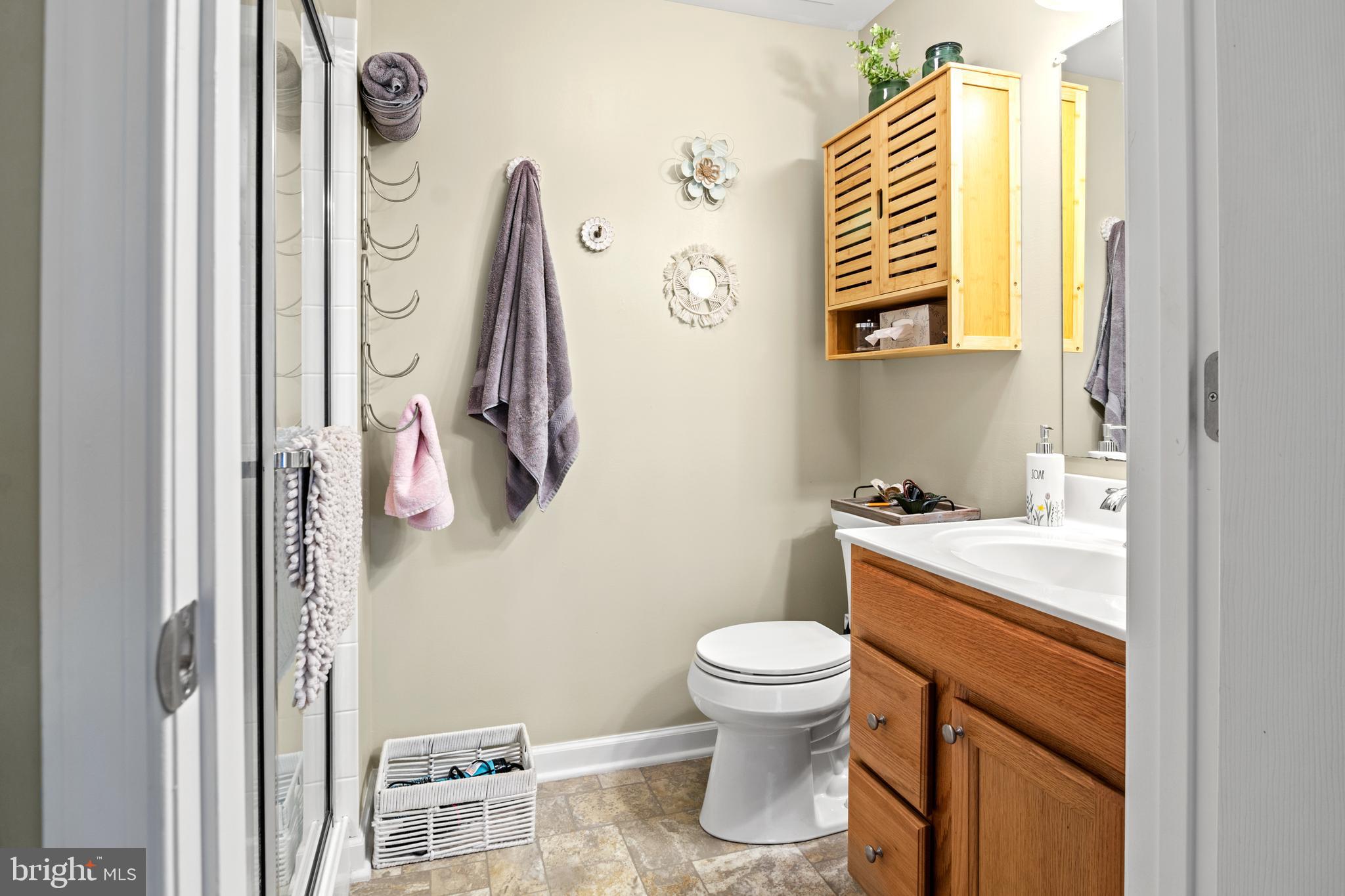 1402 Golden Rod Court, Unit 5 Belcamp, MD 21017 - Photo 18 of 28 a bathroom with a sink a toilet and a mirror