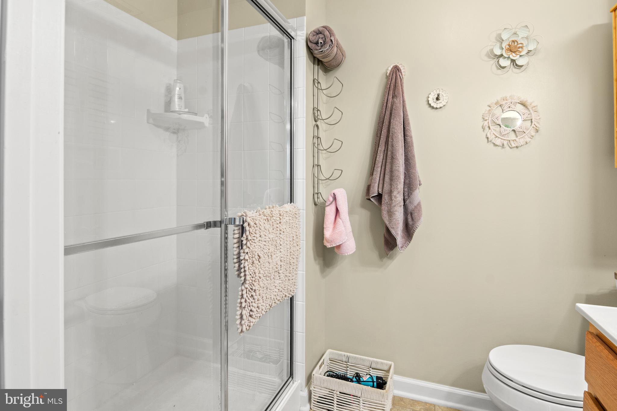 1402 Golden Rod Court, Unit 5 Belcamp, MD 21017 - Photo 19 of 28 a bathroom with a toilet and a shower curtain