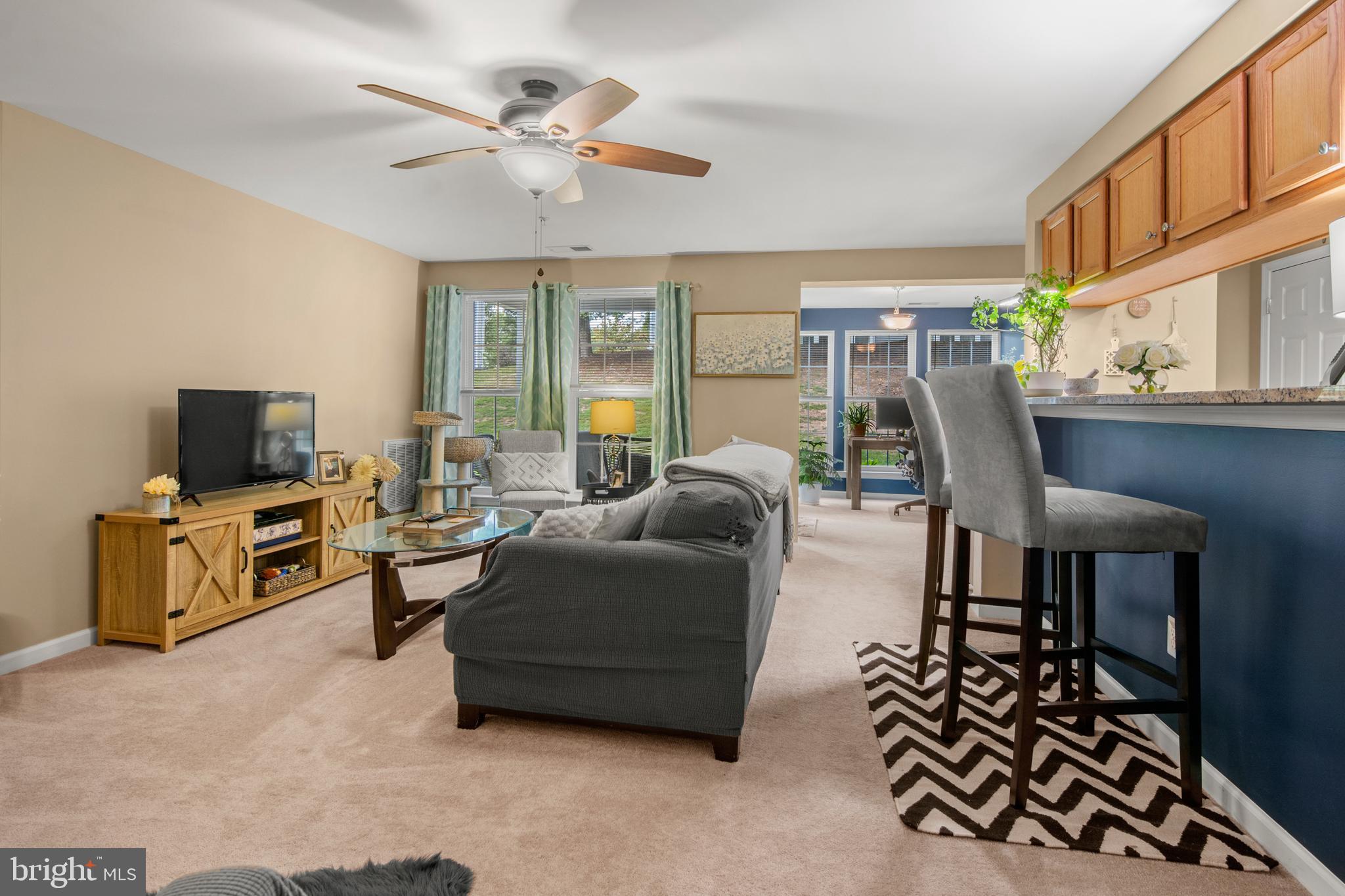 1402 Golden Rod Court, Unit 5 Belcamp, MD 21017 - Photo 28 of 28 a living room with furniture and a flat screen tv