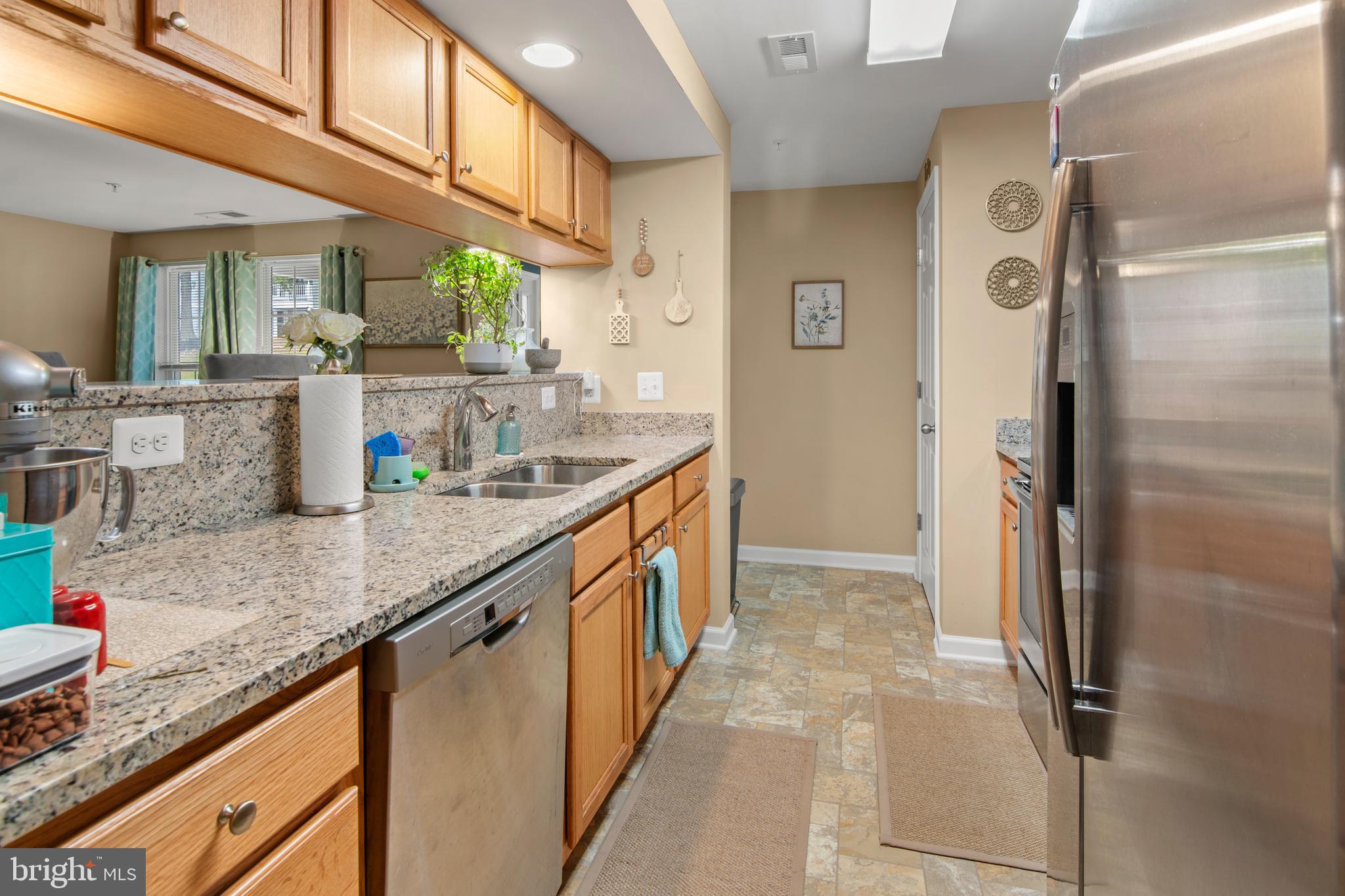 1402 Golden Rod Court, Unit 5 Belcamp, MD 21017 - Photo 2 of 28 a kitchen with stainless steel appliances granite countertop a refrigerator and a sink