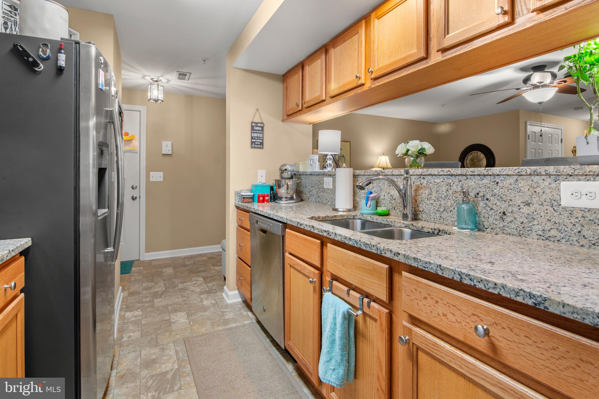 1402 Golden Rod Court, Unit 5 Belcamp, MD 21017 - Photo 5 of 28 a kitchen with stainless steel appliances granite countertop a sink and cabinets