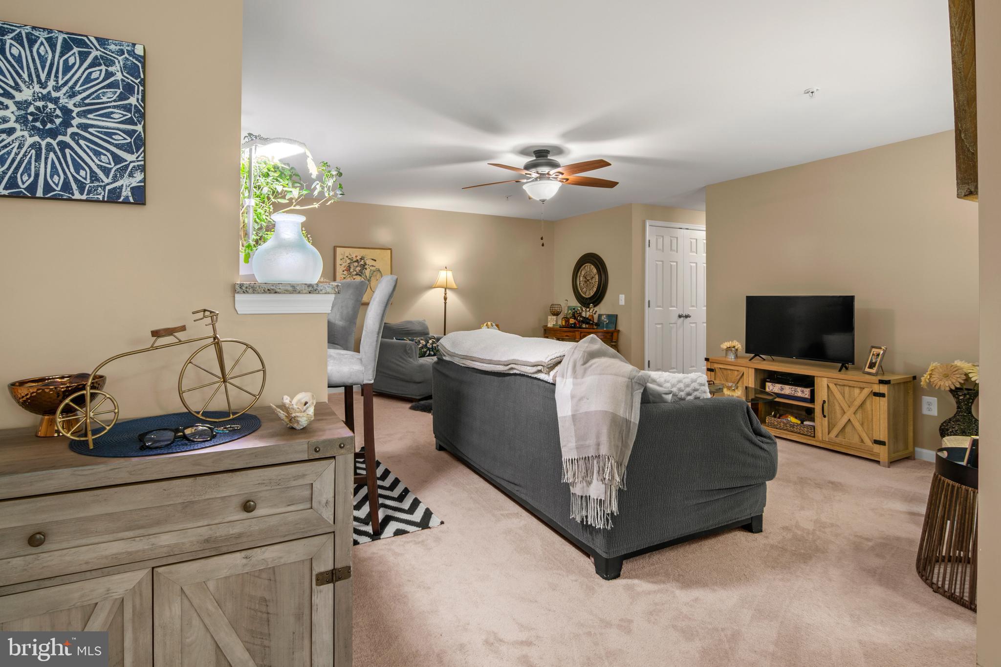 1402 Golden Rod Court, Unit 5 Belcamp, MD 21017 - Photo 8 of 28 a living room with furniture and a flat screen tv