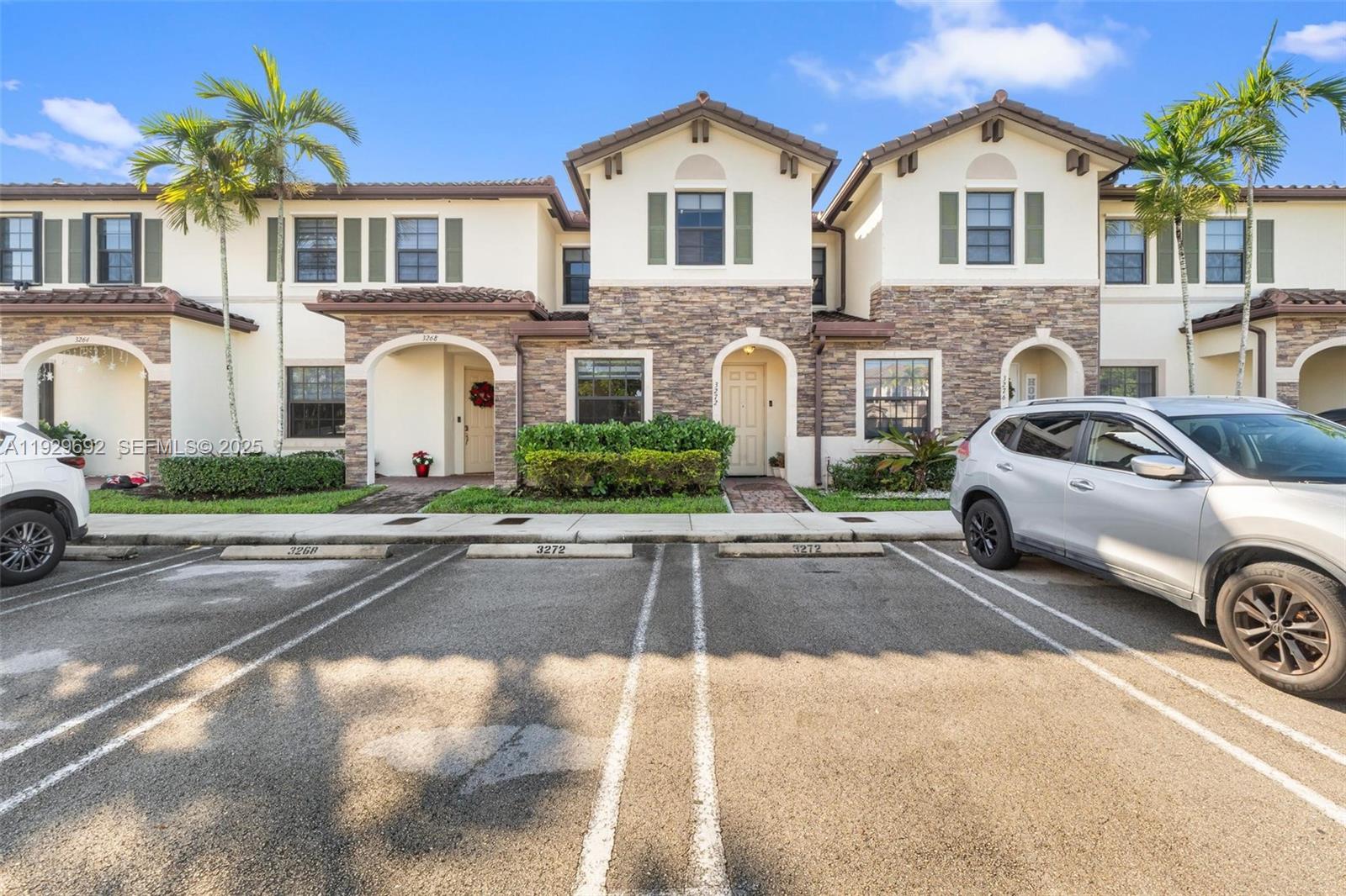 a front view of a house with parking area