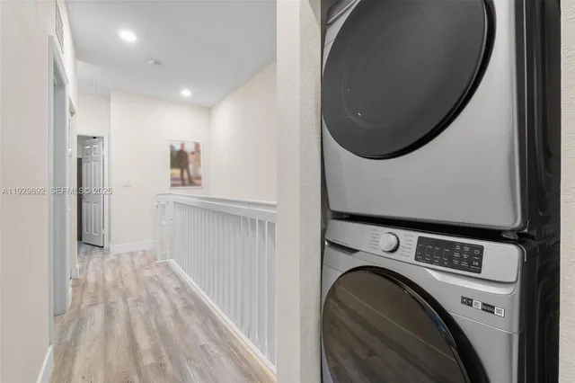 a view of a hallway with washer and dryer