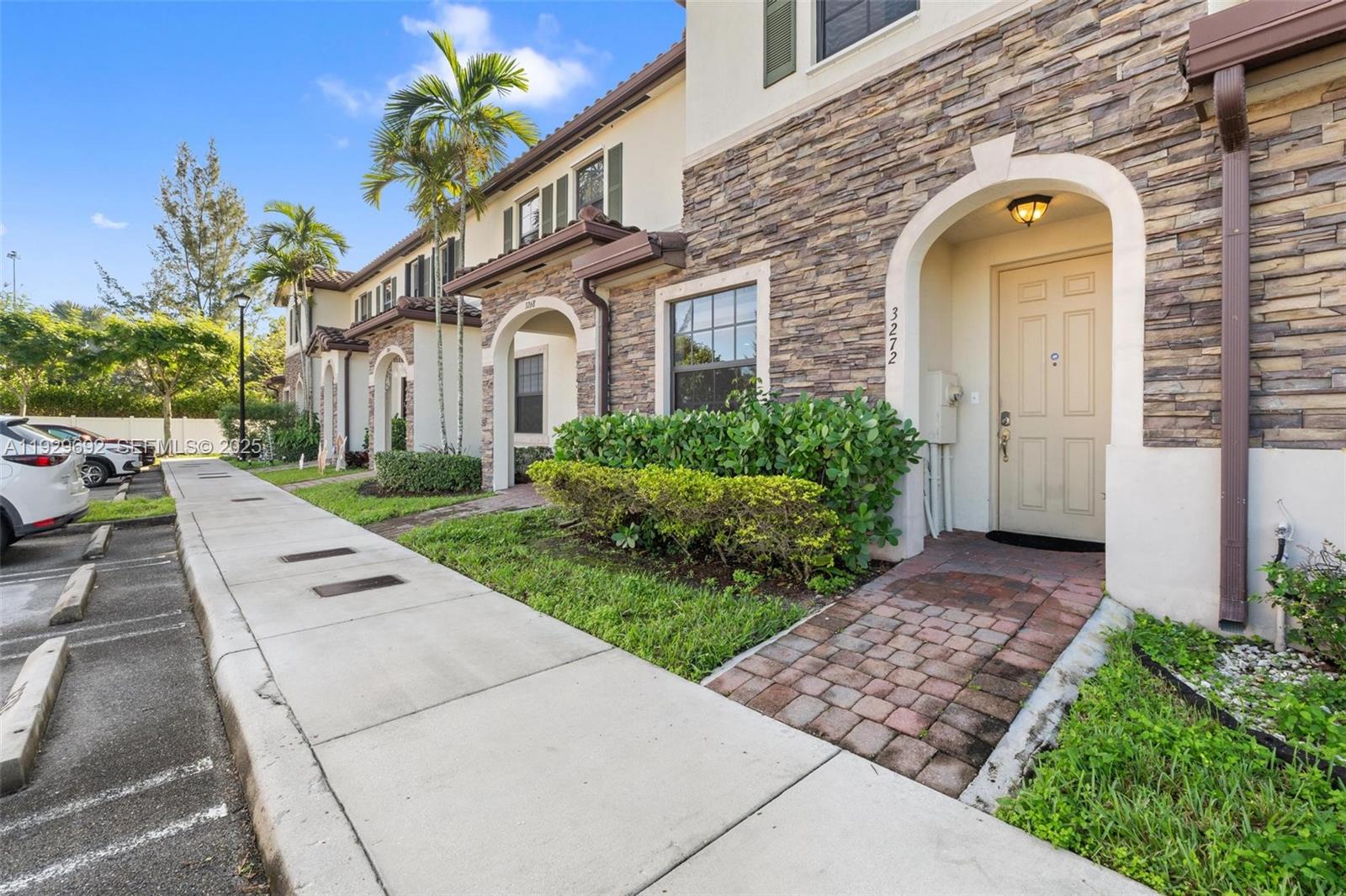 3272 West 92nd Place Hialeah, FL 33018 - Photo 2 of 37 a view of a brick house with a large windows