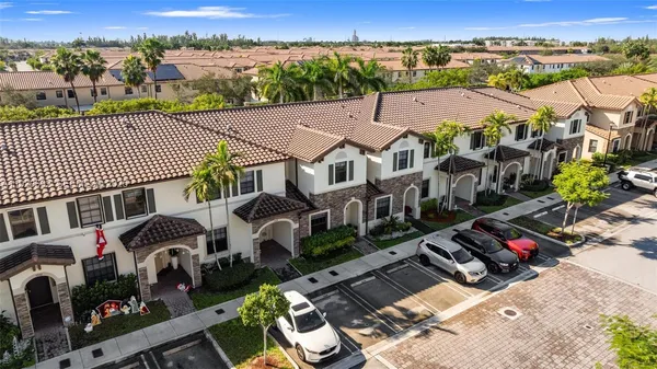an aerial view of a house with a large space