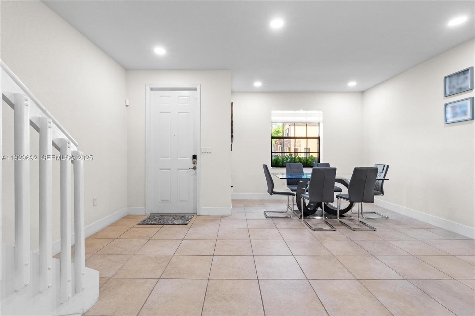 3272 West 92nd Place Hialeah, FL 33018 - Photo 4 of 37 a view of an empty room with a window