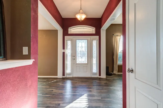 a en suite bathroom with a sink and a large mirror