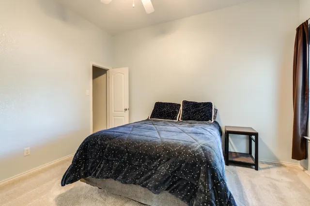 a swimming pool with trees in the background