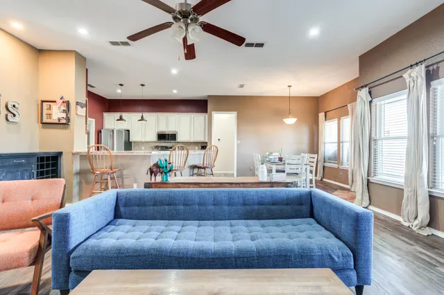 a living room with furniture and a fireplace