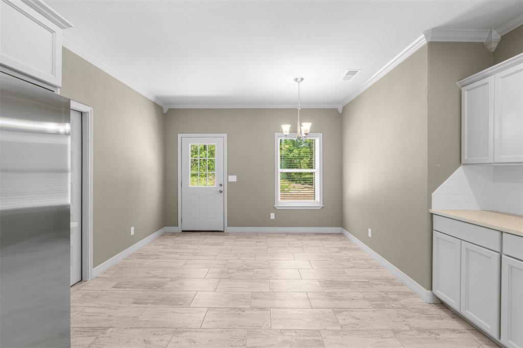 1011 Southeast County Road Corsicana, TX 75109 - Photo 14 of 40 a view of an empty room with a window