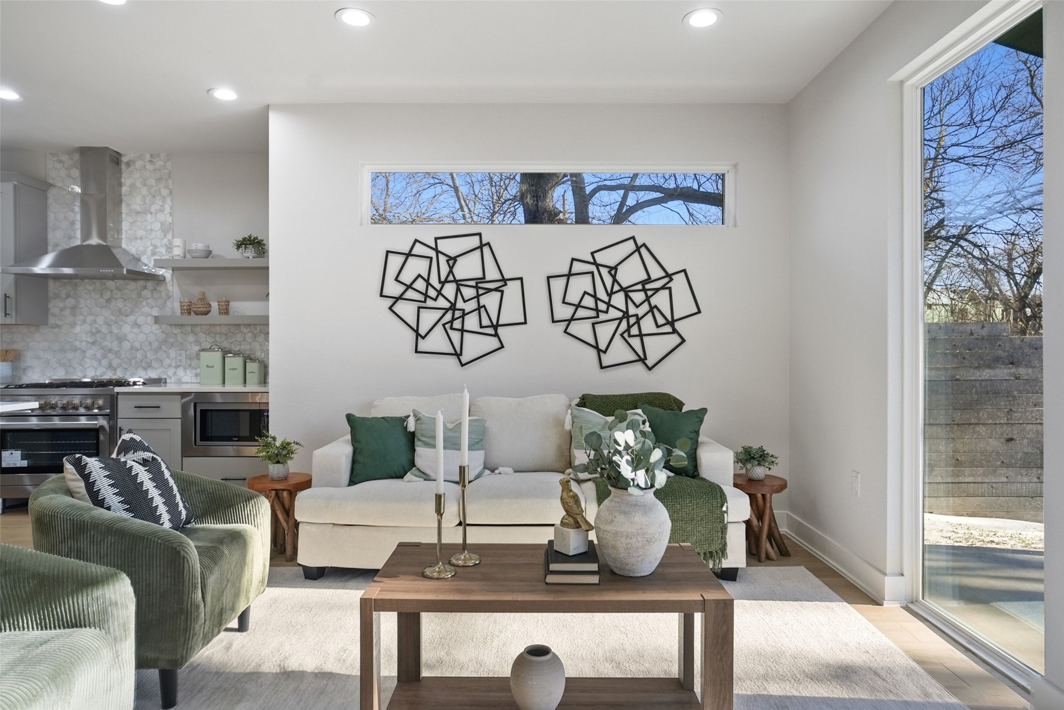 5109 Stone Gate Drive, Unit 2 Austin, TX 78721 - Photo 13 of 36 Open-concept living space featuring recessed lighting and a panoramic window