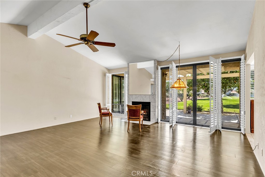 72355 Roxbury Drive Rancho Mirage, CA 92270 - Photo 15 of 61 a dining room with wooden floor a chandelier