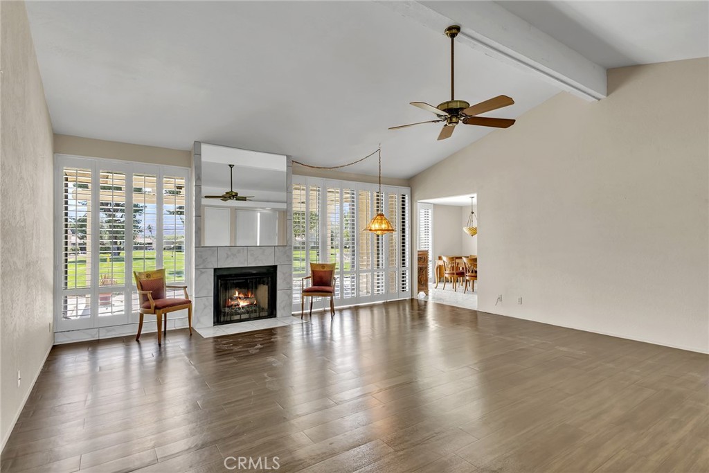 72355 Roxbury Drive Rancho Mirage, CA 92270 - Photo 17 of 61 a view of an empty room with window fireplace and wooden floor