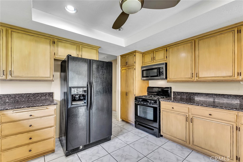 72355 Roxbury Drive Rancho Mirage, CA 92270 - Photo 32 of 61 a kitchen with granite countertop cabinets stainless steel appliances and a counter space