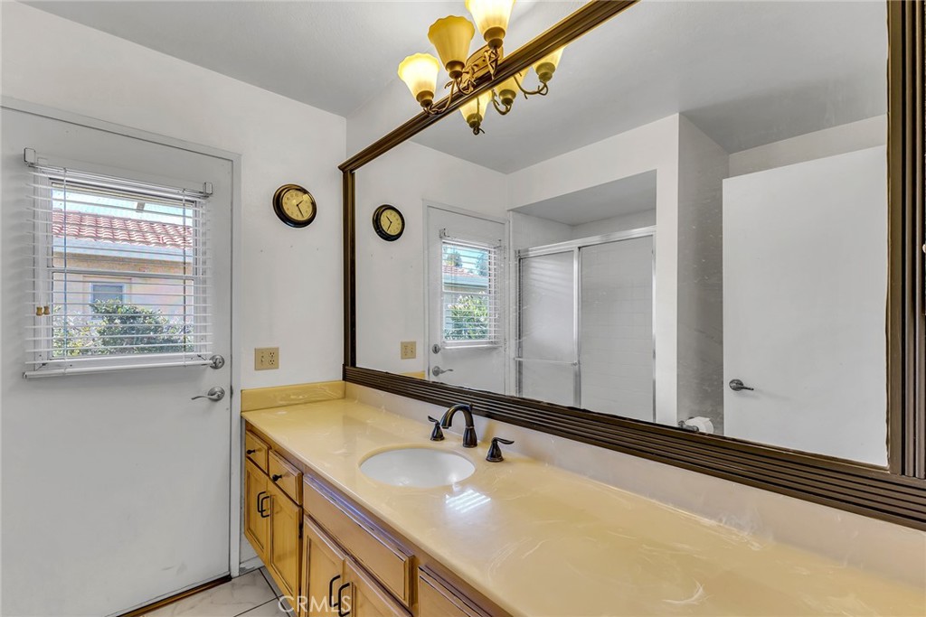 72355 Roxbury Drive Rancho Mirage, CA 92270 - Photo 34 of 61 a bathroom with a sink and a mirror