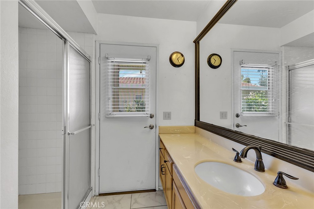 72355 Roxbury Drive Rancho Mirage, CA 92270 - Photo 35 of 61 a bathroom with a sink and a mirror