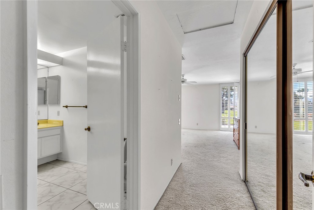 72355 Roxbury Drive Rancho Mirage, CA 92270 - Photo 38 of 61 a bathroom with a granite countertop sink and a mirror