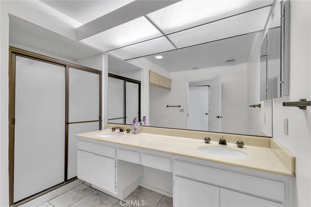 72355 Roxbury Drive Rancho Mirage, CA 92270 - Photo 44 of 61 a bathroom with a sink and a mirror