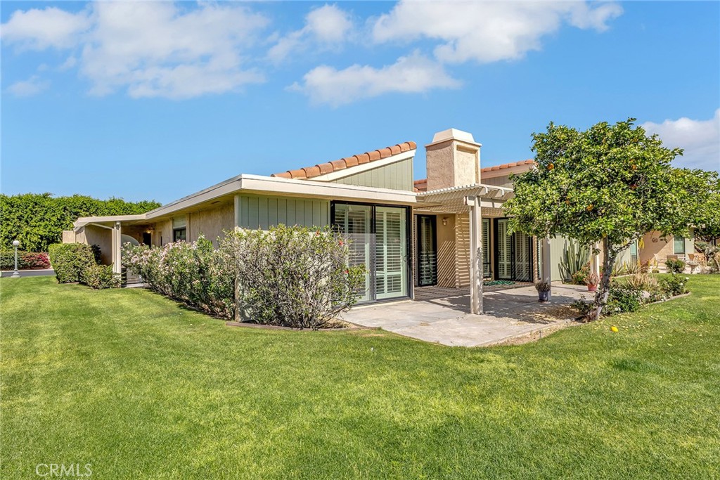 72355 Roxbury Drive Rancho Mirage, CA 92270 - Photo 51 of 61 a front view of a house with garden