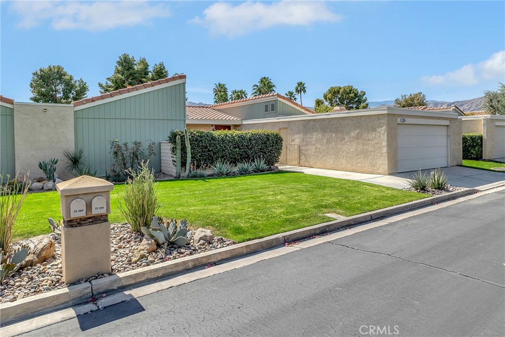 72355 Roxbury Drive Rancho Mirage, CA 92270 - Photo 8 of 61 a view of a backyard with plants and a patio