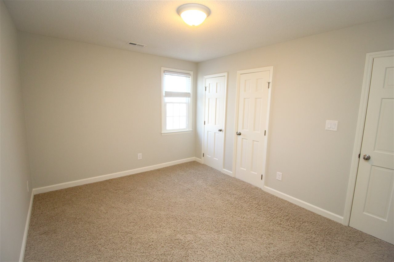 6332 Jones Farm Road Wake Forest, NC 27587 - Photo 12 of 28 Newer, well-maintained carpet in two of three bedrooms with new engineered flooring in the third! Bedroom