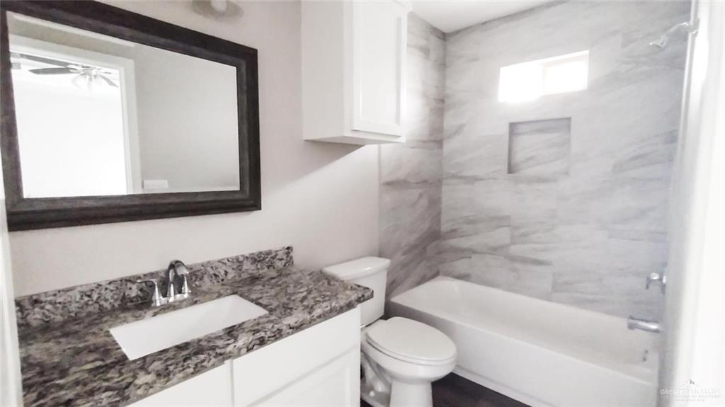 701 Cathedral Hill, Unit 1 Edinburg, TX 78541 - Photo 11 of 14 Full bath featuring vanity and shower / washtub combination