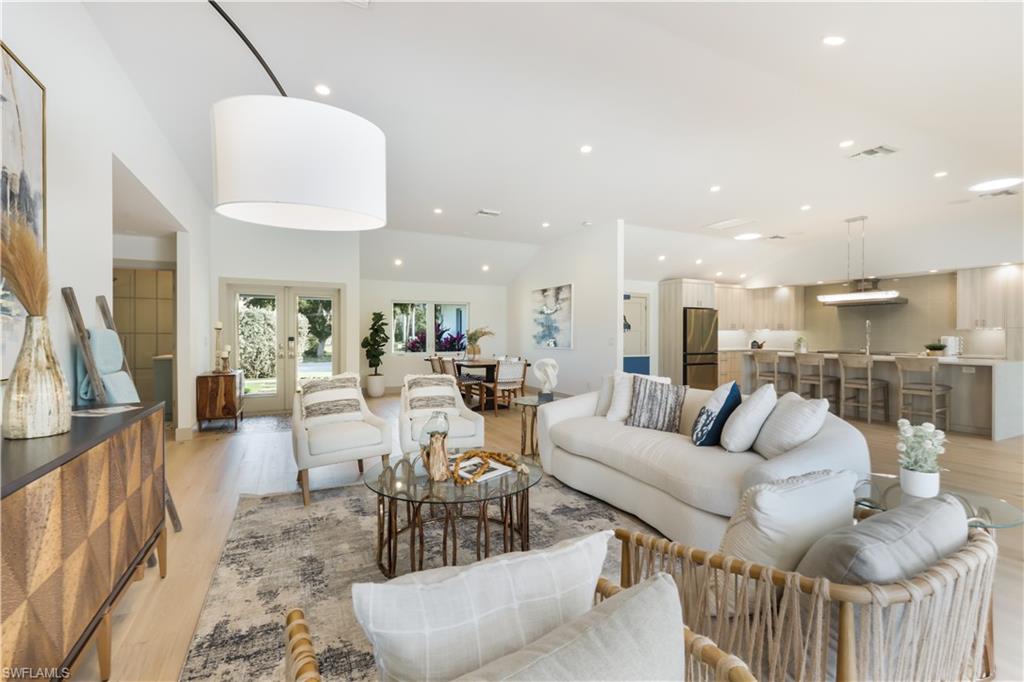 5215 Seashell Avenue Naples, FL 34103 - Photo 47 of 47 a living room with furniture and a view of kitchen