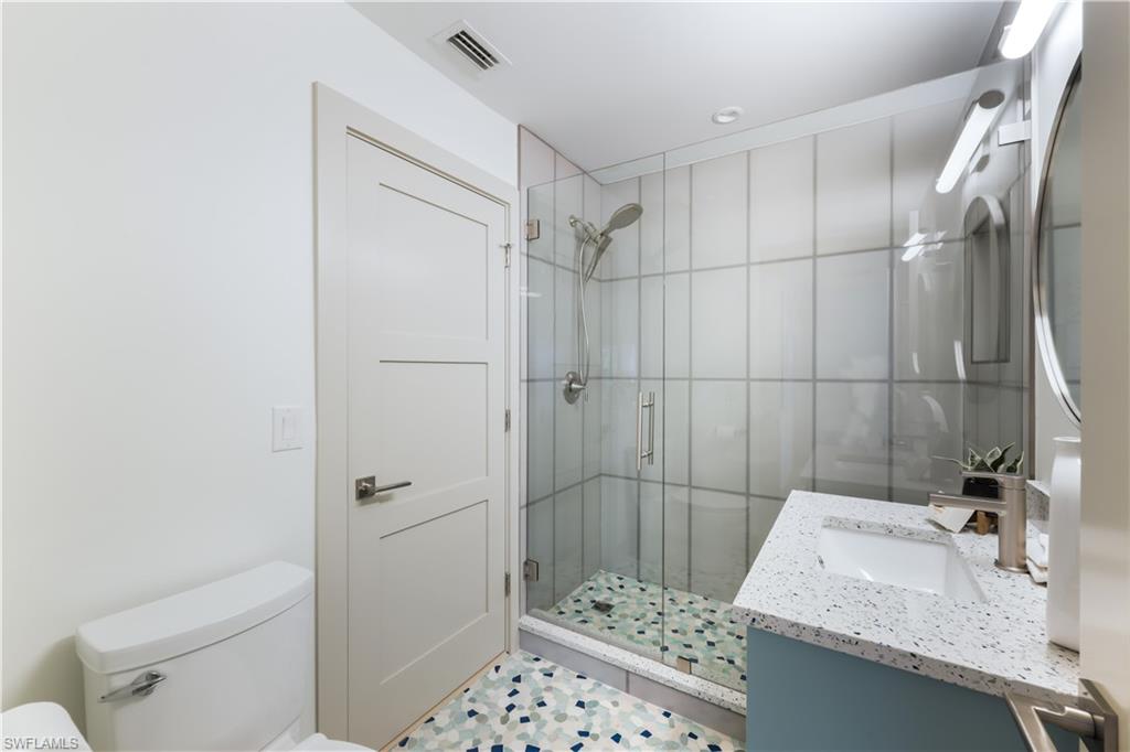 5215 Seashell Avenue Naples, FL 34103 - Photo 23 of 47 a bathroom with a sink toilet and shower
