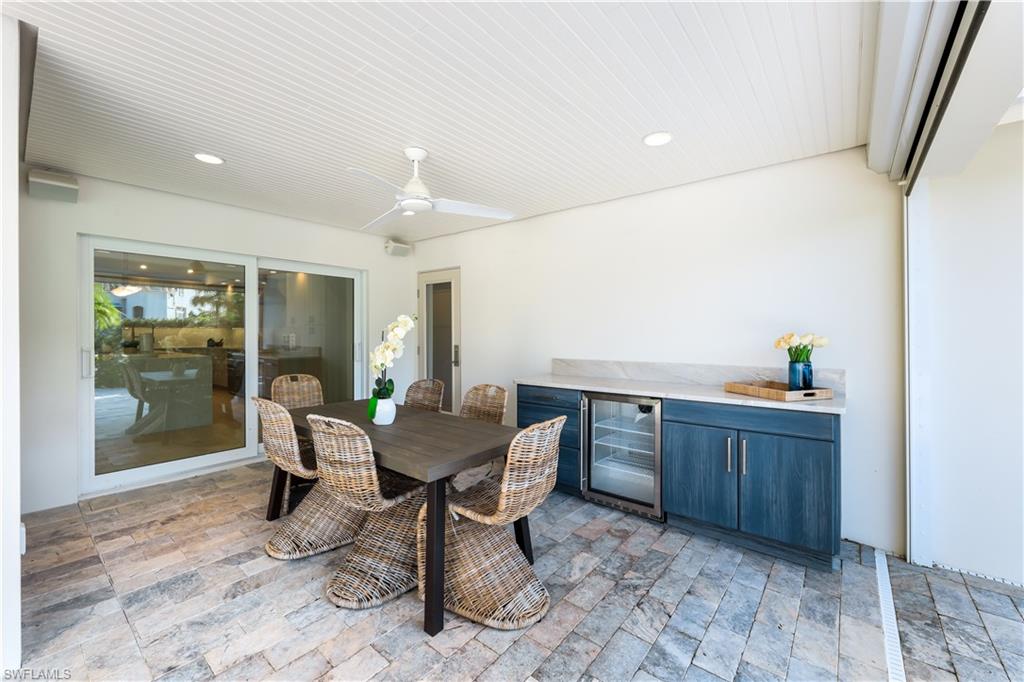 5215 Seashell Avenue Naples, FL 34103 - Photo 28 of 47 a view of a dining room with furniture