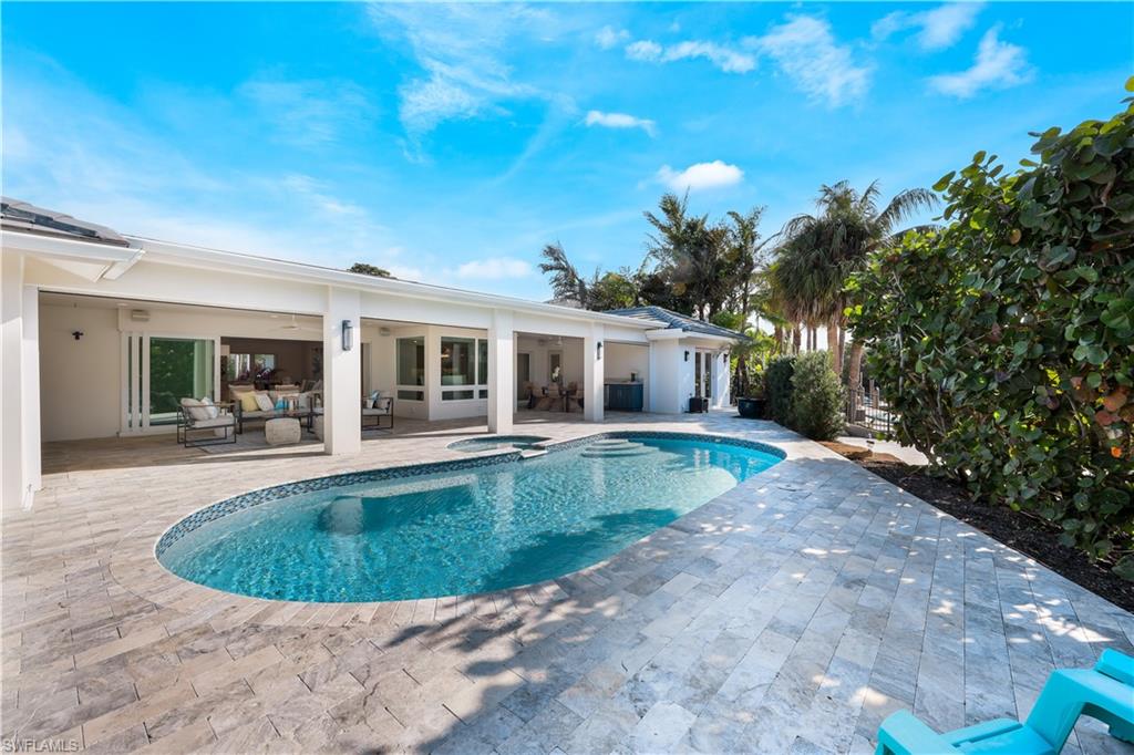 5215 Seashell Avenue Naples, FL 34103 - Photo 30 of 47 a view of outdoor space yard swimming pool and patio