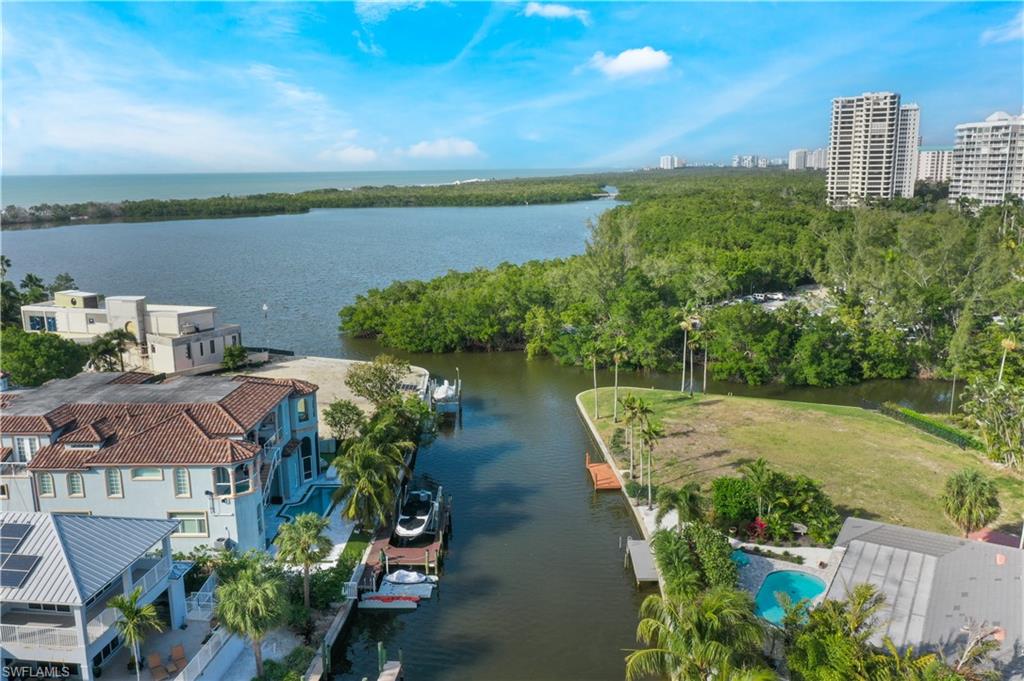 5215 Seashell Avenue Naples, FL 34103 - Photo 37 of 47 an aerial view of a house with lake view