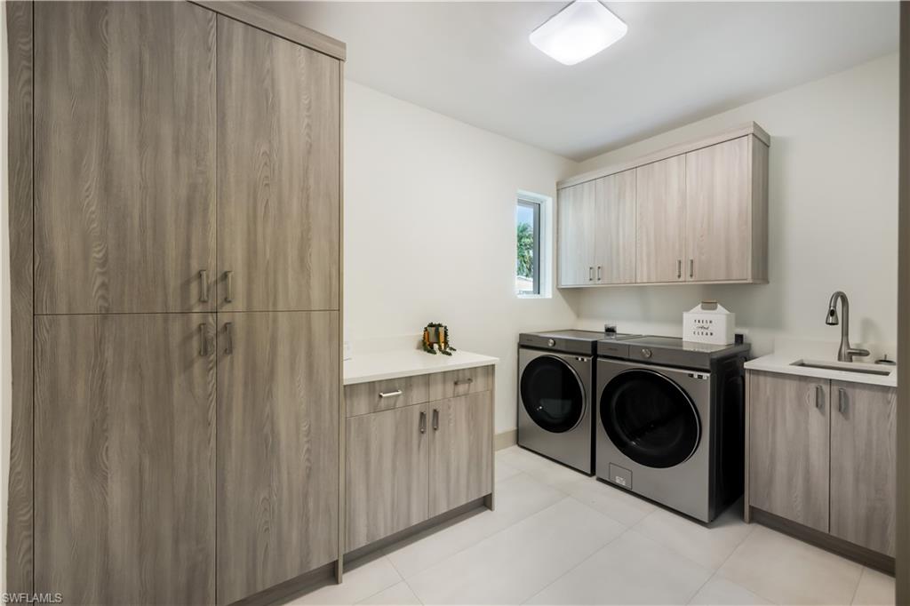 5215 Seashell Avenue Naples, FL 34103 - Photo 38 of 47 a utility room with sink dryer and washer