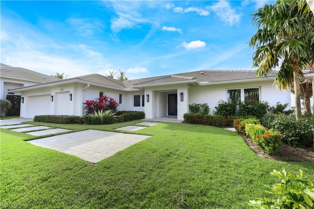 5215 Seashell Avenue Naples, FL 34103 - Photo 3 of 47 a view of house with a garden