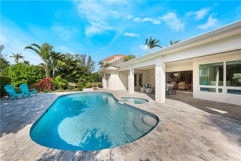 5215 Seashell Avenue Naples, FL 34103 - Photo 45 of 47 a view of a house with swimming pool