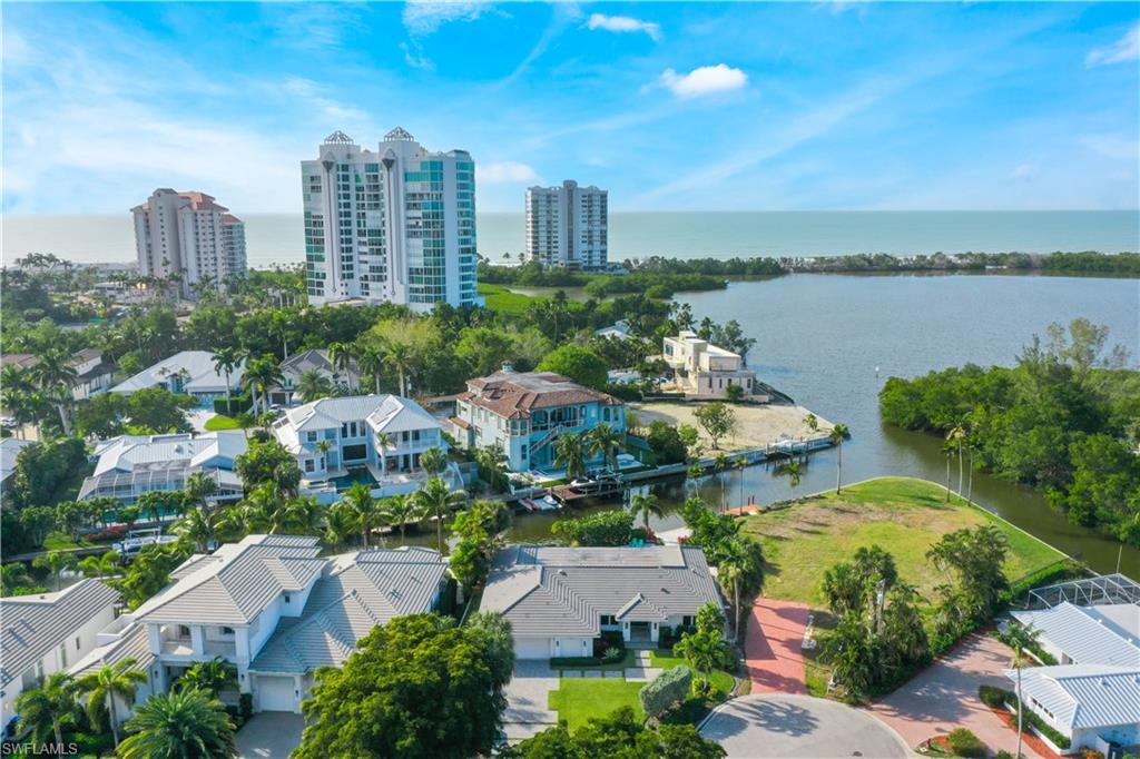 5215 Seashell Avenue Naples, FL 34103 - Photo 46 of 47 a view of a city with tall buildings