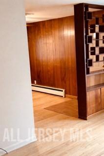 364 South Madison Avenue Dunellen, NJ 08812 - Photo 3 of 12 a view of an empty room with wooden floor