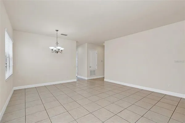 an empty room with a empty space and a window