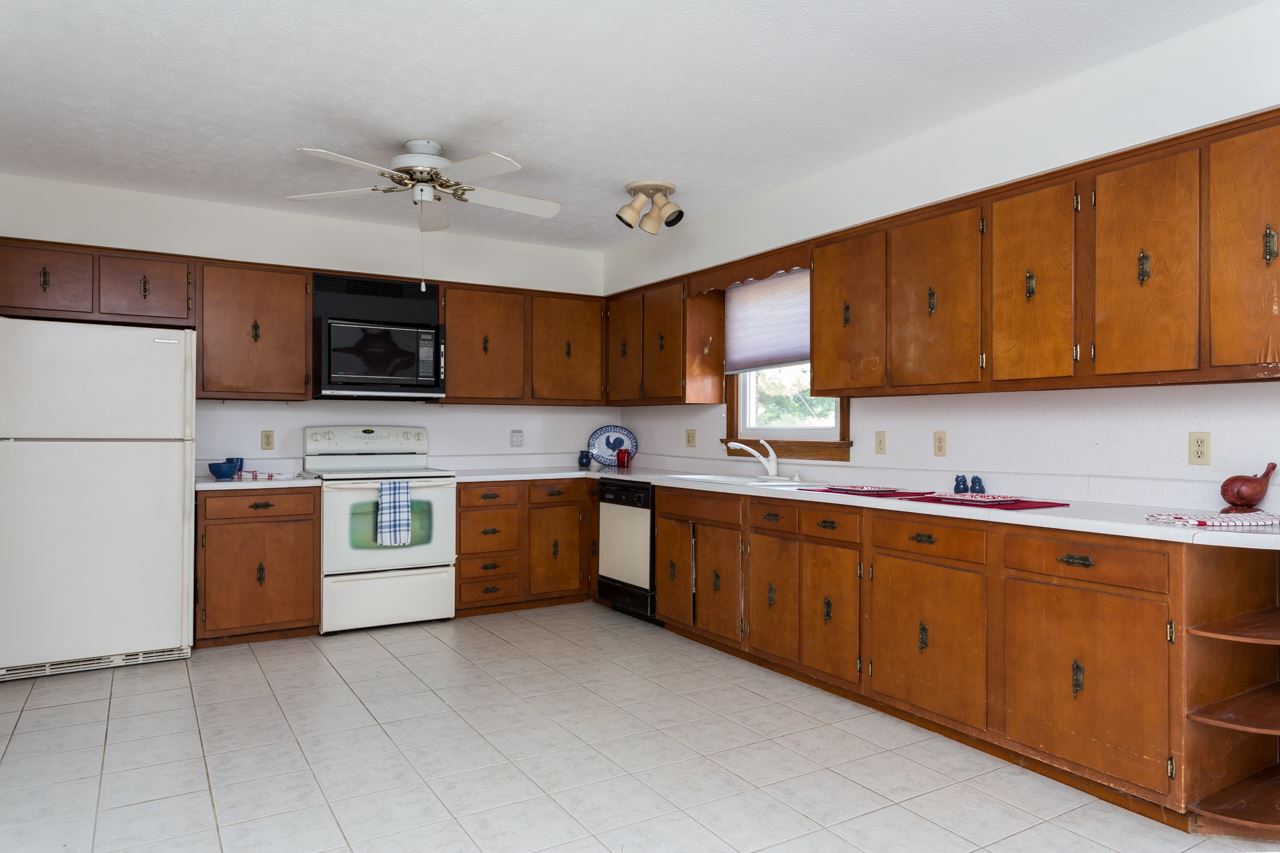 311 Varner Road Churchville, VA 24421 - Photo 3 of 29 a kitchen with stainless steel appliances granite countertop a refrigerator sink and stove