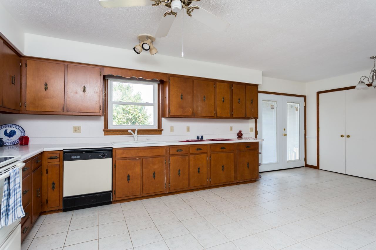 311 Varner Road Churchville, VA 24421 - Photo 7 of 29 a kitchen with stainless steel appliances granite countertop a sink cabinets and window