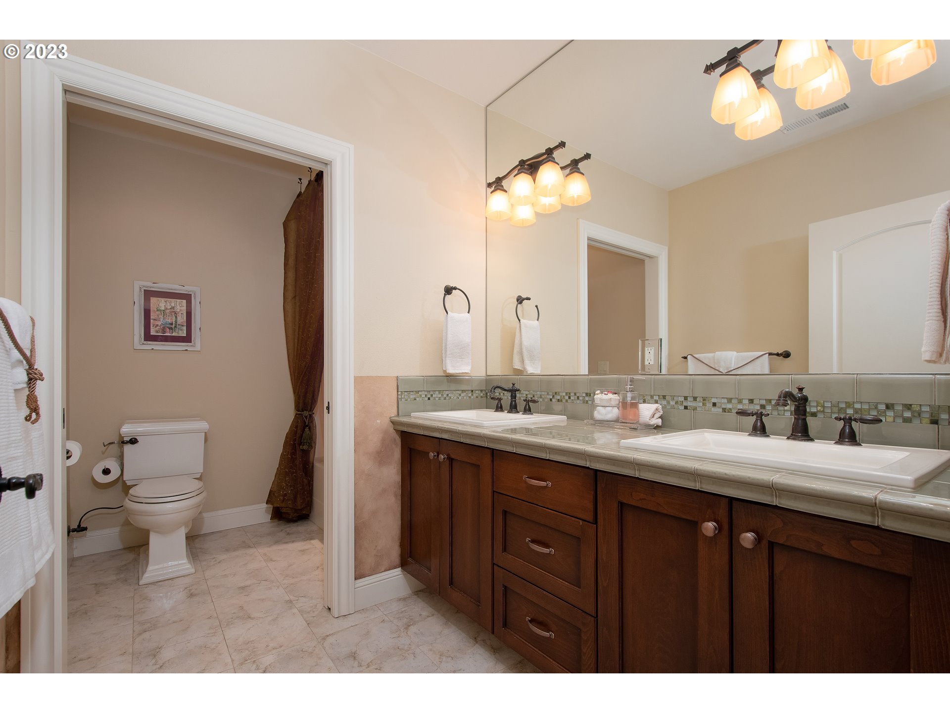 1601 South 8th Way Ridgefield, WA 98642 - Photo 23 of 32 a bathroom with a double vanity sink and a mirror