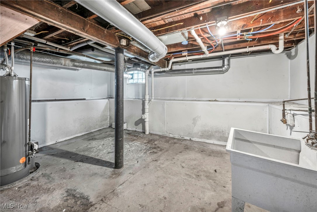 1386 Sunset Road Cleveland, OH 44124 - Photo 18 of 28 Basement with water heater and sink