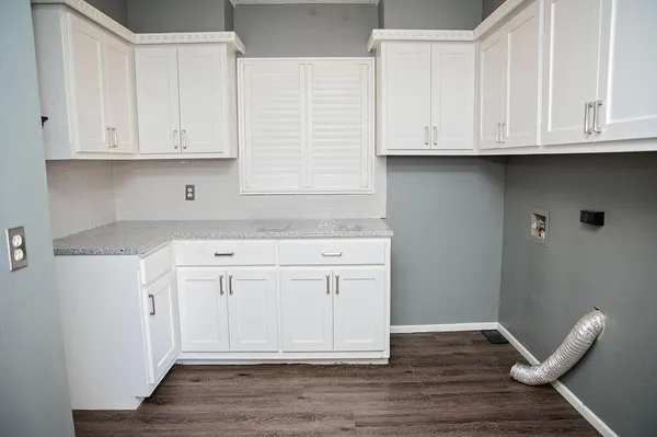 a view of cabinets and wooden floor