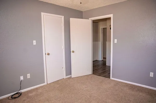 a view of a livingroom with wooden floor and closet