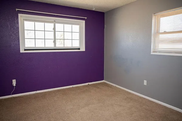a view of empty room with windows