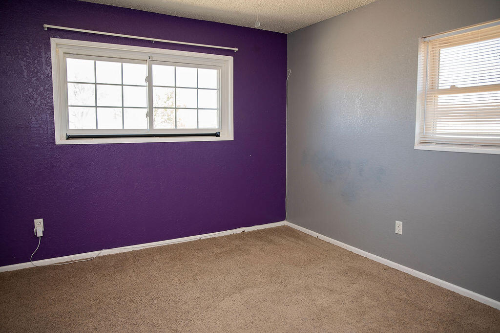 1410 2nd Street Plains, TX 79355 - Photo 23 of 35 a view of empty room with windows
