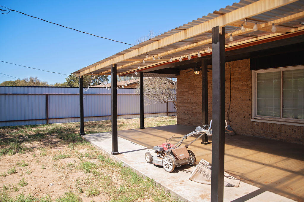 1410 2nd Street Plains, TX 79355 - Photo 30 of 35 a view of a patio with a table and chairs