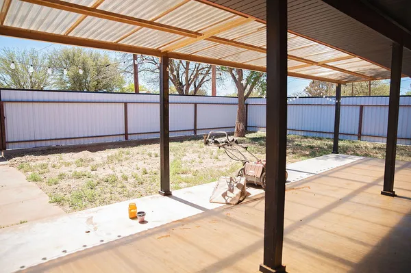 a view of a balcony and a yard