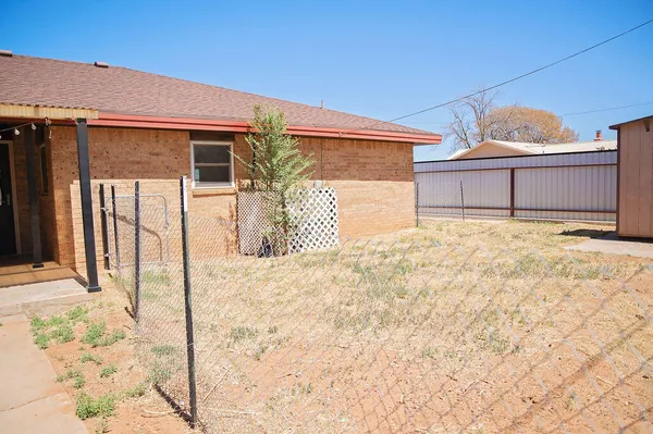 a front view of a house with a outdoor space