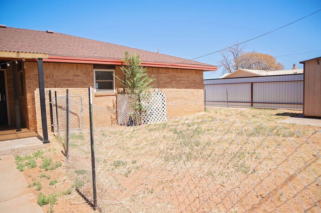 1410 2nd Street Plains, TX 79355 - Photo 33 of 35 a front view of a house with a outdoor space